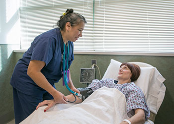 Image of nurse taking patient's blood pressure